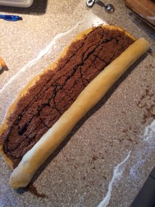 Pumpkin Spice Cinnamon Roll rolling up